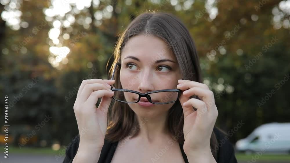 Woman wearing optical glasses looking at camera Woman wearing optical glasses looking at camera