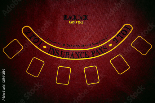 Black Jack gambling table. Red background.