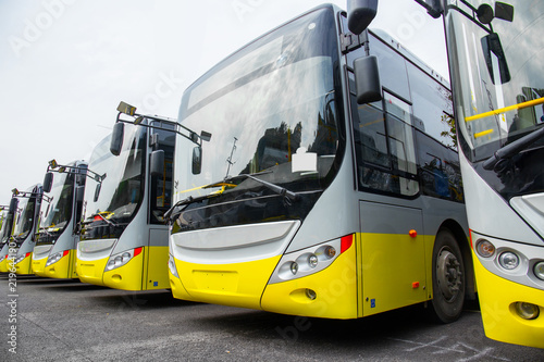 New electric bus parked in open-air parking lot