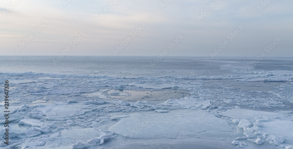 Frozen sea view on sunny day.