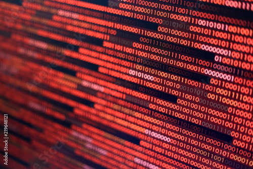red binary code. computer technology background. red binary code computer language data transfers. unsecured and dangerous big data and ai artificial intelligence cyber network.