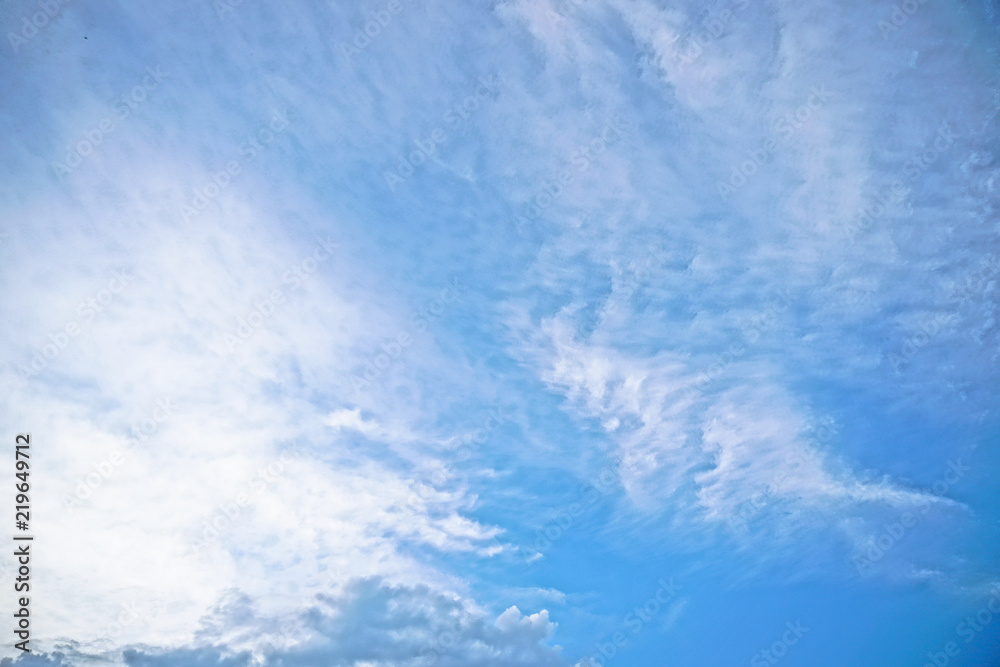 Beautiful white and gray clouds against the blue sky. Summer and autumn day with a view from the airplane to the atmosphere. Stock Photo for design Beautiful white and gray clouds against the blue sky. Summer and autumn day with a view from the airplane to the atmosphere. Stock Photo for design