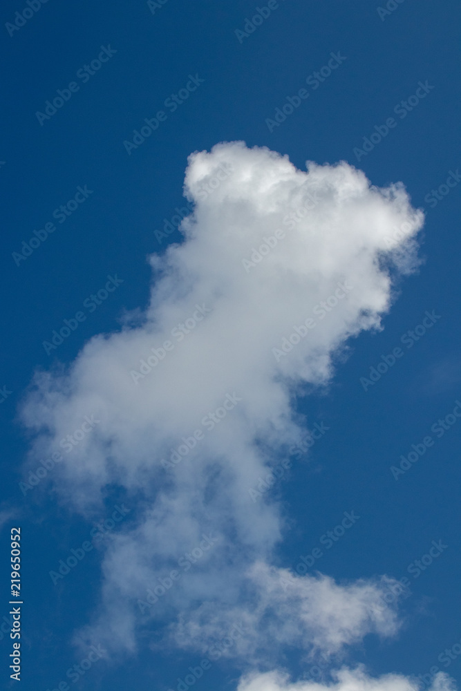rising cloud on a perfect blue sky rising cloud on a perfect blue sky