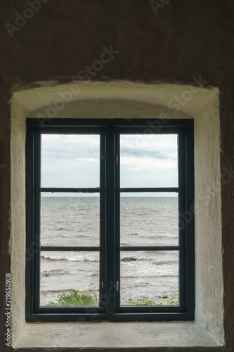 Old window with view over sea