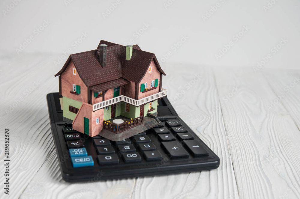 Buying a house, building repair and mortgage concept. Estimation real estate property with loan money and banking Buying a house, building repair and mortgage concept. Estimation real estate property with loan money and banking