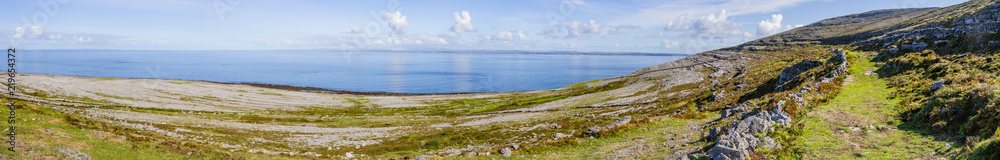 Panorama of Hiking trail with stone walls in Burren mountains