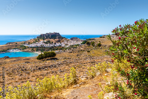 Fototapeta Naklejka Na Ścianę i Meble -  View of the bay and the village of Lindos with the Acropolis on the hill.Rhodes, island, Greece