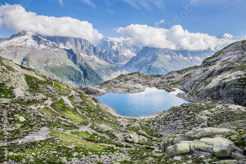 Alpine Lake and Snowy Mont-Blanc Mountains Range on a Sunny Summer Day