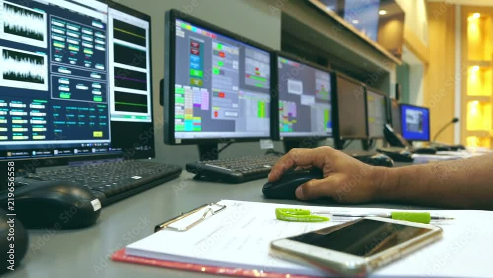 Slow motion: Male Asian engineers are operating in a regulated electricity system
