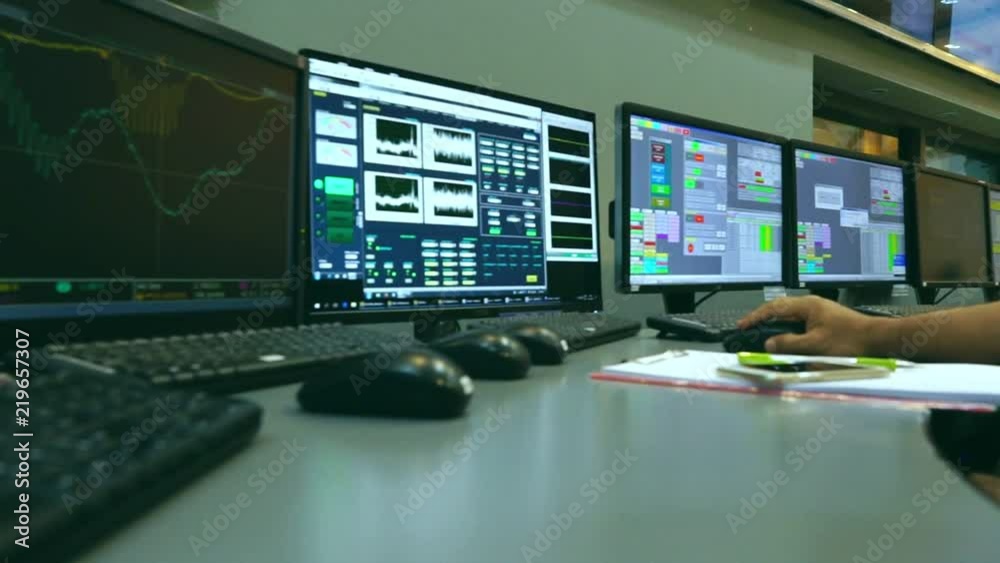 Slow motion: Male Asian engineers are operating in a regulated electricity system