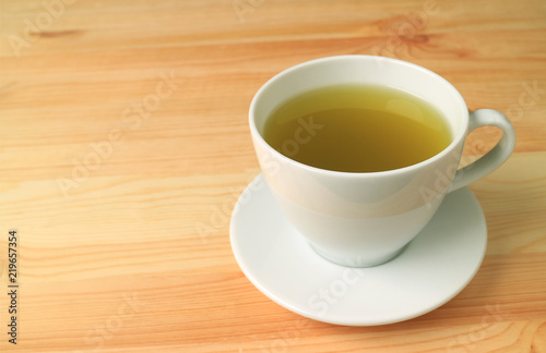 Hot Japanese Green Tea Served on Natural Color Wooden Table 