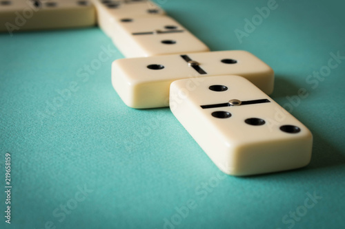 Playing dominoes on a light background . The concept of the game of dominoes. Close up