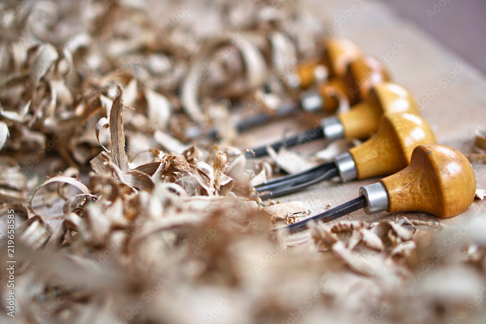 Woodworking and crafts tools. Carpentry hand tools. Planers, chisels, measuring tools.  lot of sawdust. Wooden background.