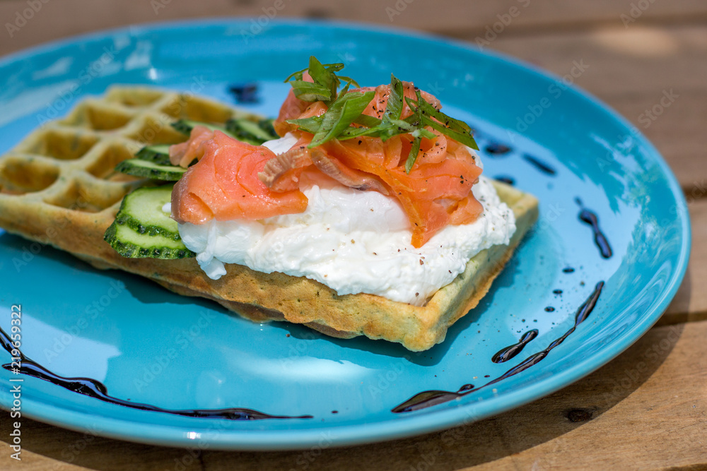 Healthy eating food breakfast waffles, salmon and poached egg Healthy eating food breakfast waffles, salmon and poached egg