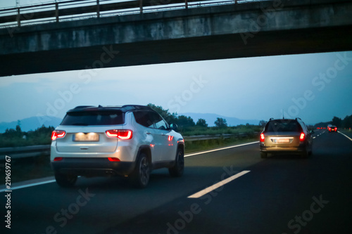 Traffic on the highway at sunset