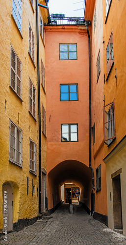 Fototapeta Naklejka Na Ścianę i Meble -  Stockholm old narrow cobblestone street in the historical city center gamla stan. Sweden.