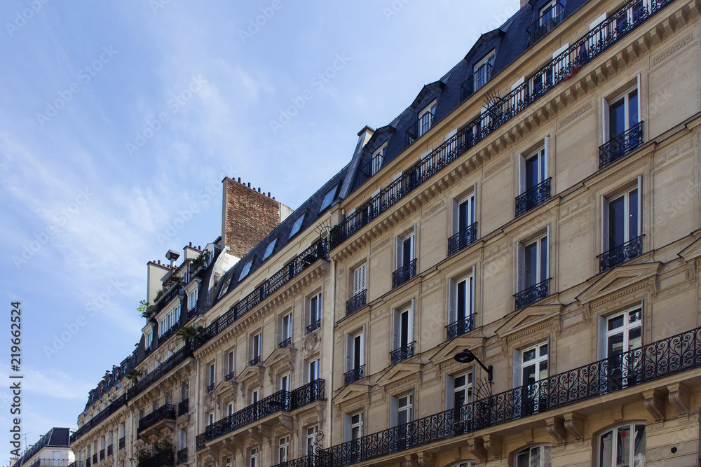 Obraz premium View of historical, traditional buildings showing Parisian / French architectural style. It is a sunny spring day in Paris. 2nd arrondissement