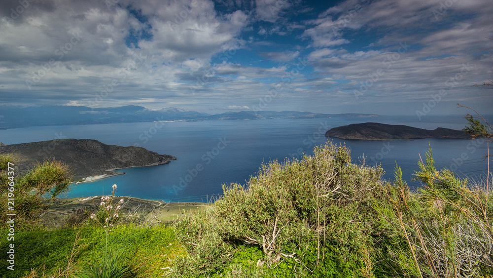 Island view in crete greece with clouds and blue water