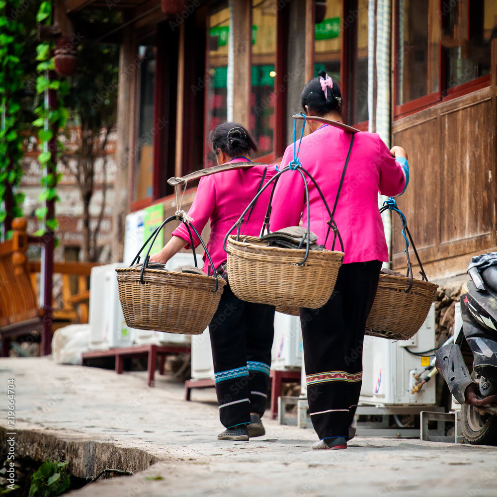 Woman with bamboo baskets