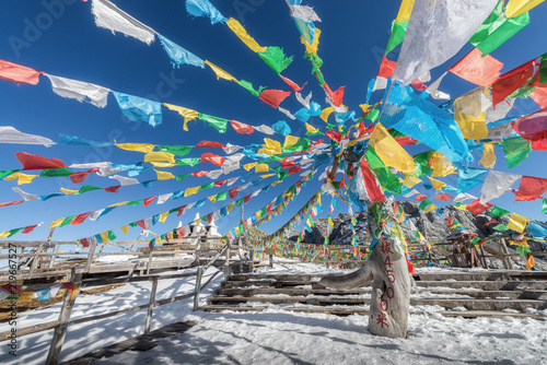4500 m above sea level signage with hanging prayer flag at the peak of Shika snow mountain in Blue Moon Valley National Park, Shangri La, Yunnan, China