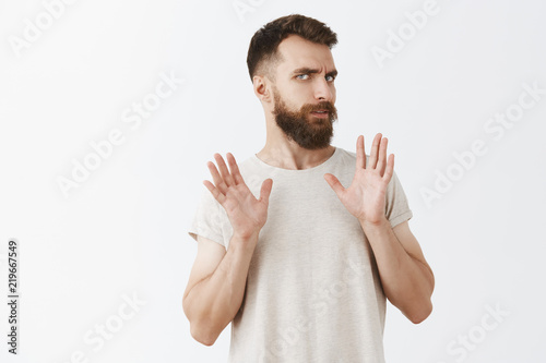Bilde på lerret Man dislikes strange offers rejecting friend invitation raising palms near chest