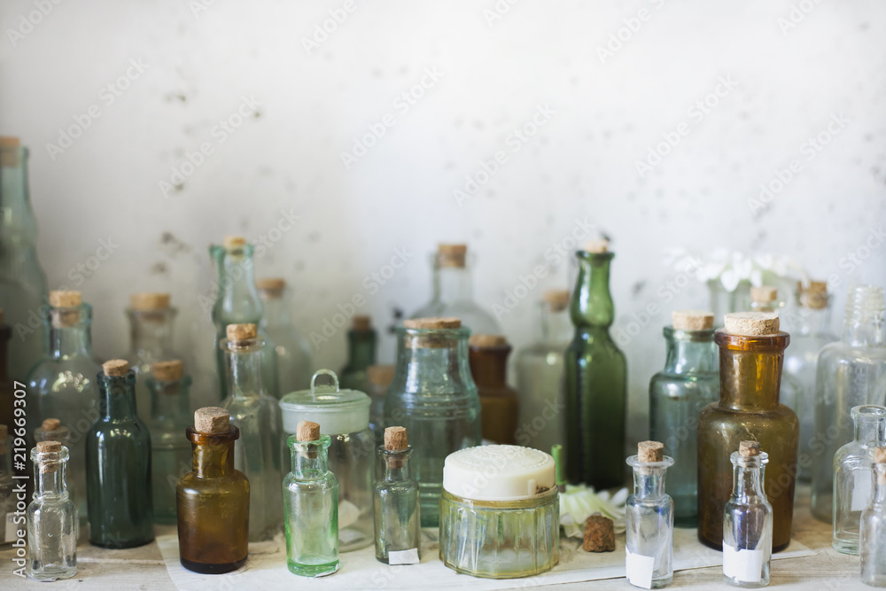 different glass bottles and jars on the shelf different glass bottles and jars on the shelf