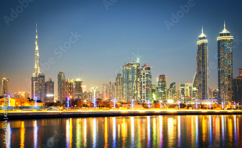 DUBAI  UAE - FEBRUARY 2018  Colorful sunset over Dubai Downtown skyscrapers and the newly built Tolerance bridge as viewed from the Dubai water canal.