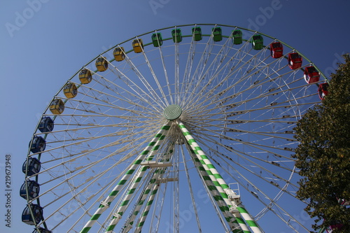 The big ferris wheel at the fair in the daylight