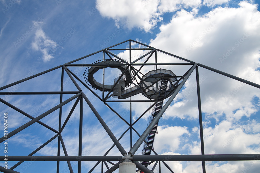 Bottrop, Germany-AUGUST 11,2018:The tetrahedron, steel tube structural sculpture which foam as pyramid or tetrahedron is located on the hill top of the mine dump Halde Beckstraße in Bottrop, Germany. Bottrop, Germany-AUGUST 11,2018:The tetrahedron, steel tube structural sculpture which foam as pyramid or tetrahedron is located on the hill top of the mine dump Halde Beckstraße in Bottrop, Germany.