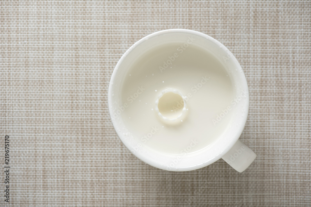 top view of glass milk with ripples drops top view of glass milk with ripples drops