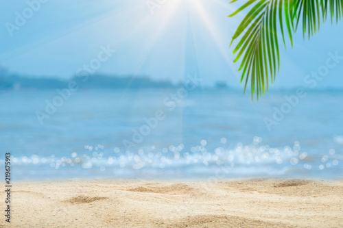 Fototapeta Naklejka Na Ścianę i Meble -  Top of wood table with blurred sea and palm tree background,Concept Summer, Beach, Sea, Relax.