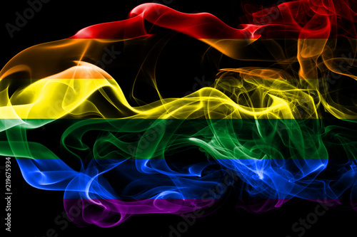 Gay flag made from colored smoke isolated on black background. Abstract silky wave background. Pride flag