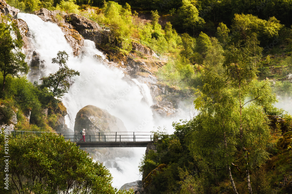 Kleivafossen waterfall near Briksdal glacier in Norway. Summer landscape