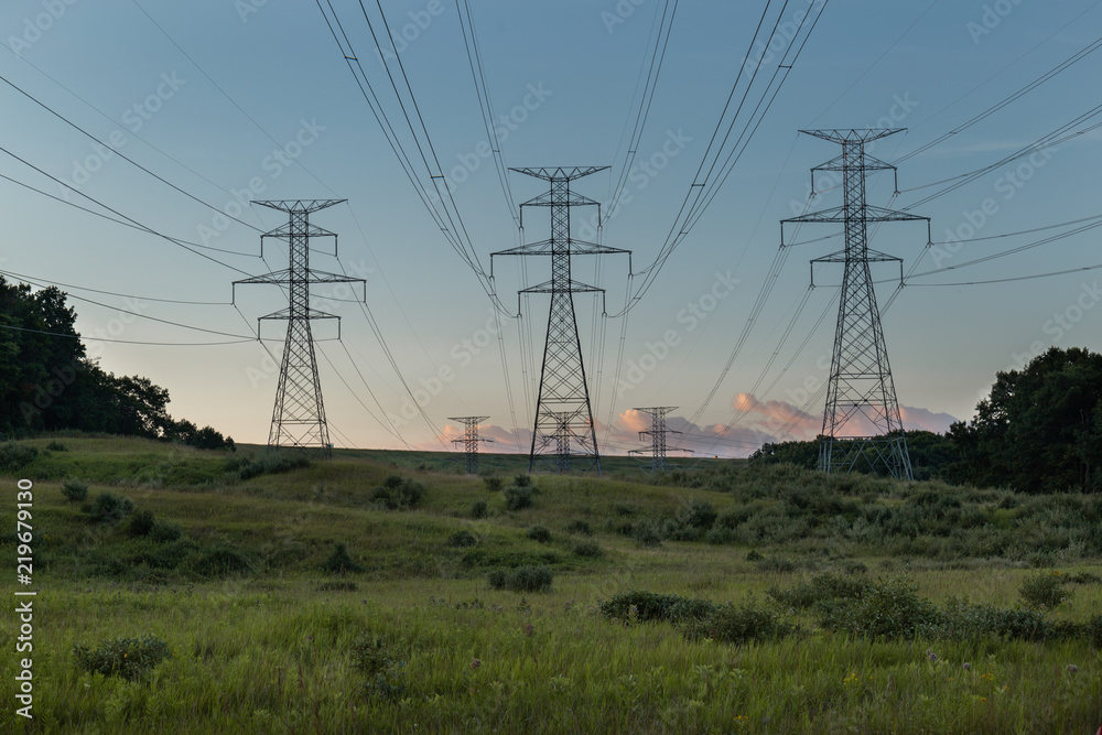 Power Electrical Lines From Hydro Electric Plant by Fields at Sunrise Sunset