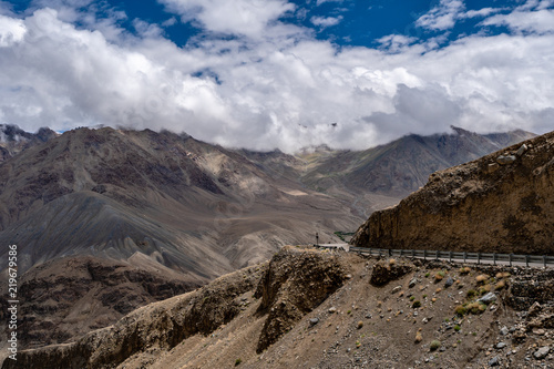 Khardung La Pass Leh Ladakh India Highest road of The World in Summer with Blue Cloudy sky and mountains