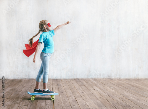 Super girl skating on a skateboard photo