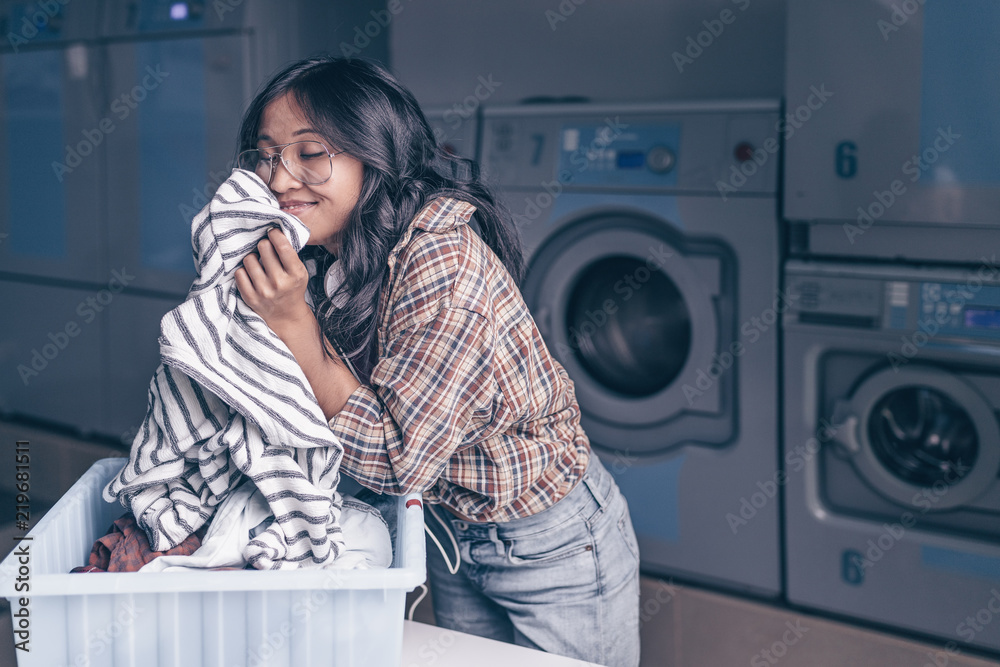 Young girl with a basket in the laundry