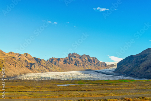 Skeidararjokull Glacier and blue sky. Skaftafell National Park, Iceland photo