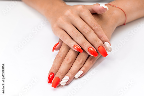 Female manicure on white background closeup