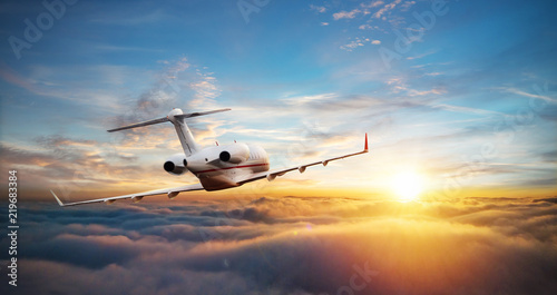 Canvas-taulu Private jet plane flying above clouds