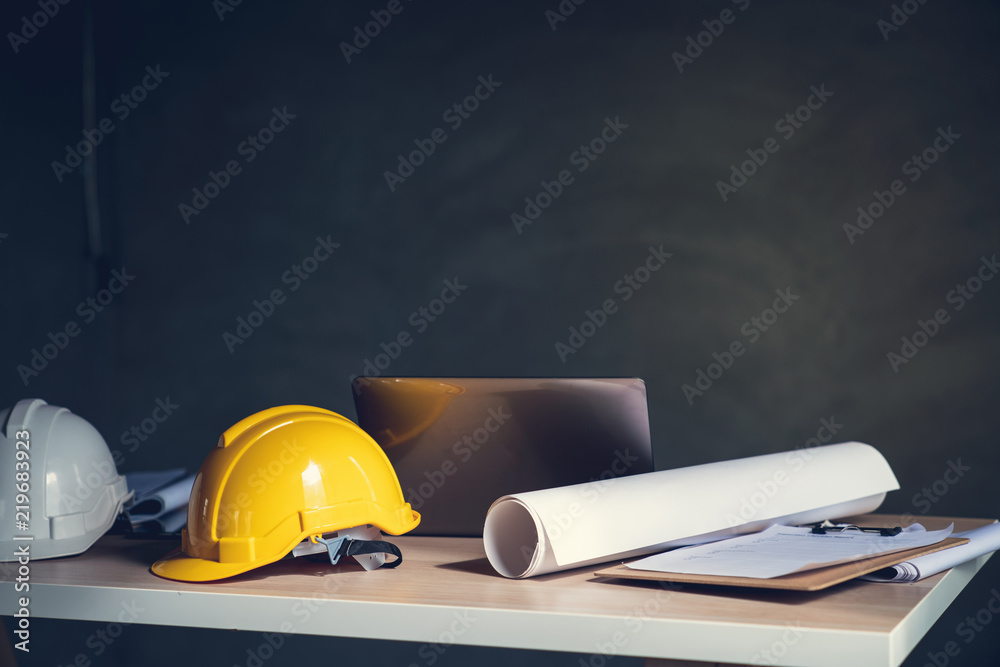 Top view desk work table architect with drawing home plan building and stationary in home office includes copyspace for add text or graphic Top view desk work table architect with drawing home plan building and stationary in home office includes copyspace for add text or graphic