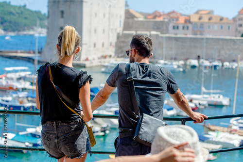 A guy and a girl look at the Marina in Dubrovnik,Croatia.