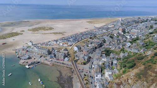 Aerial view, landing down move. Drone panorama over sea, harbor, beach and old city of Barmouth, Wales