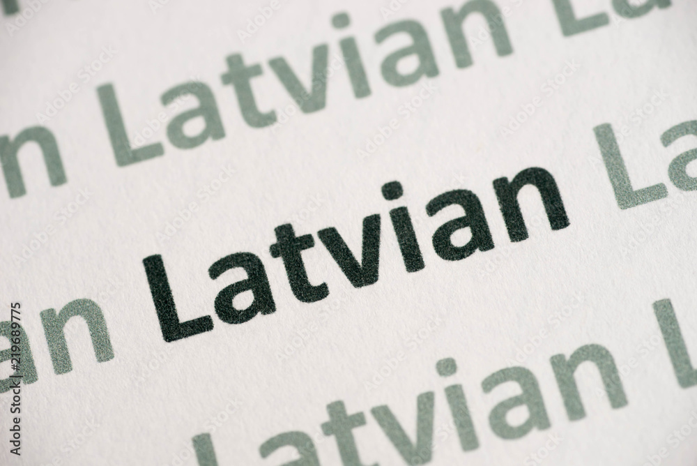 word Latvian language printed on paper macro