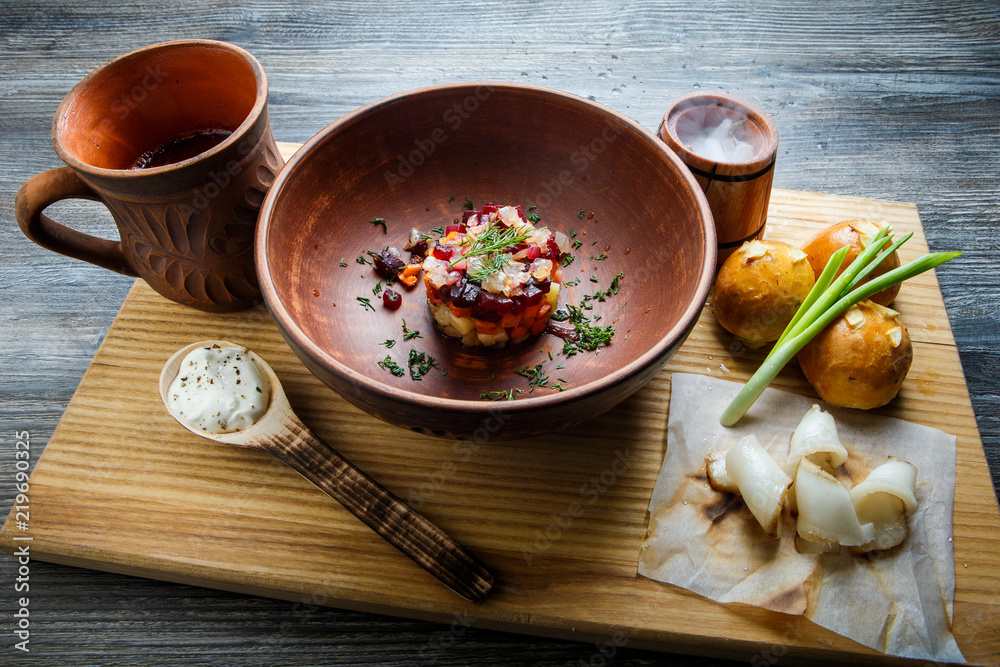 wooden table topped with plates of traditional ukrainian food wooden table topped with plates of traditional ukrainian food