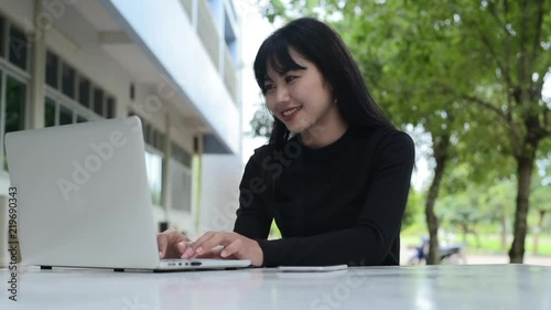 Happy woman feeling excited looking at laptop screen sitting at workplace, celebrates business success, online win, positive good news in email, positive result, passed exam, got job, being promoted