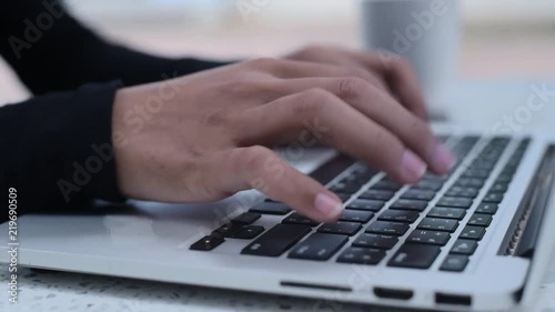 Women's hands typing on computer RUSSIAN keyboard 