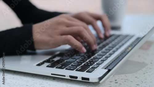 Women's hands typing on computer RUSSIAN keyboard 