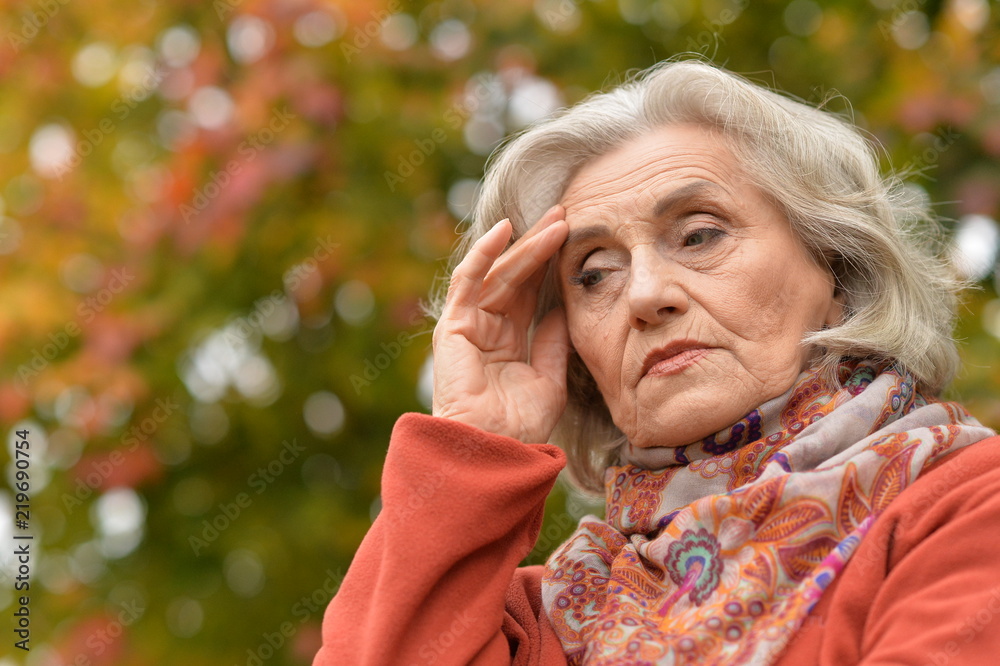 Portrait of beautiful senior woman in park Portrait of beautiful senior woman in park