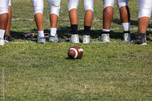 Football placed on field – Players getting ready for the game 
